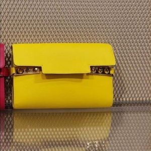 2 delvaux crossbody bags one in yellow and the other one in light blue and white